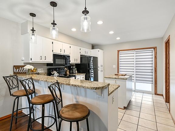Breakfast bar, kitchen, new lighting, new patio doors