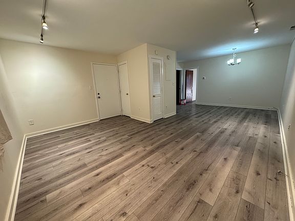 Condo entry / Living Room / dining space. Open floor plan.