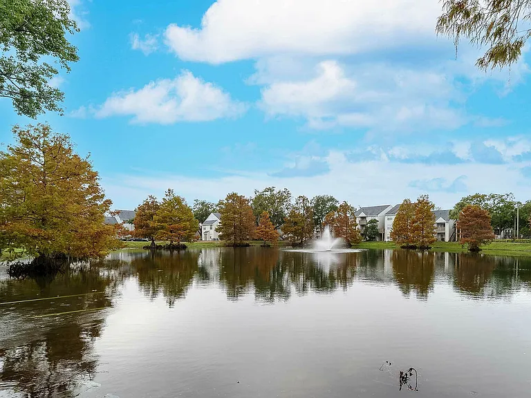 Experience tranquil living by the lake with stunning views and elegant architecture.