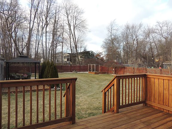 Deck overlooks private yard
