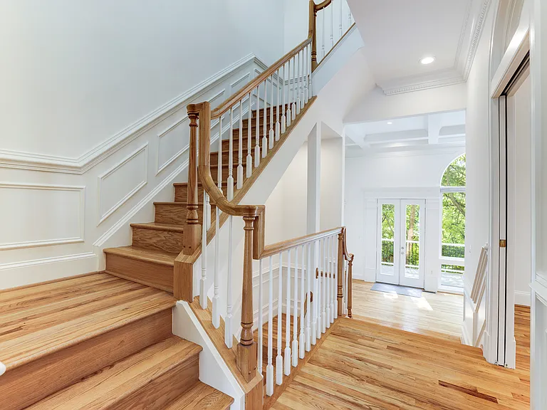 Staircase off of middle level to upper level bedrooms and laundry.