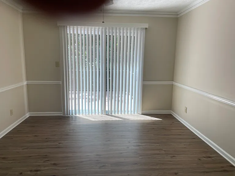Open the dining room onto a lovely deck overlooking private wooded area.