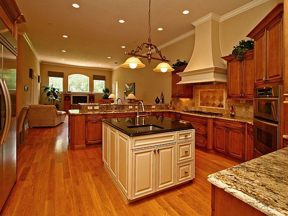Beautiful exotic granite and hard woods grace this beautiful kitchen