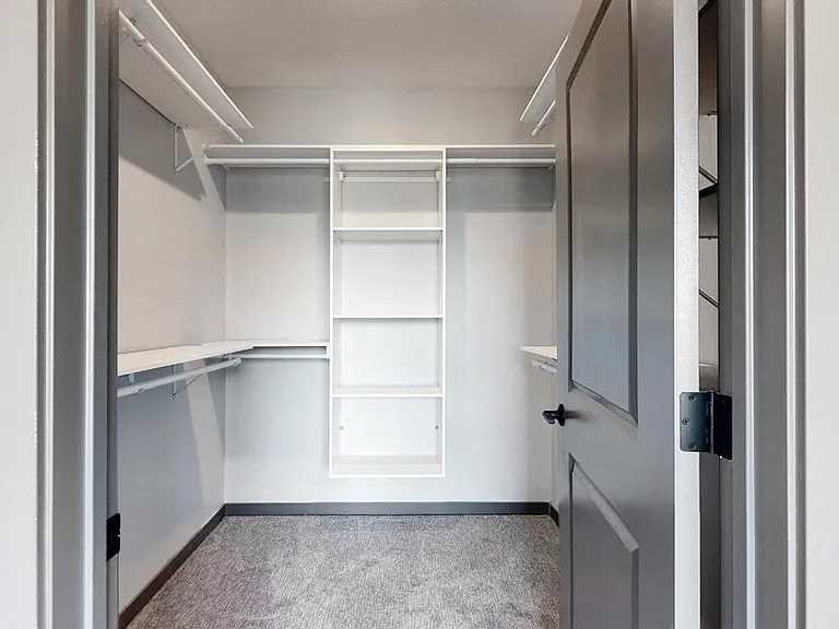 Large walk-in closets offer plenty of space to keep your wardrobe organized.