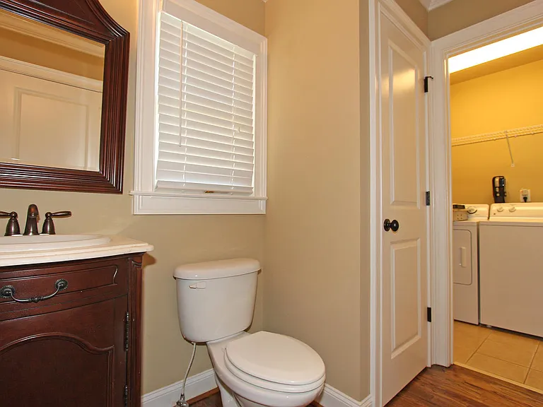 Powder room looking into laundry room