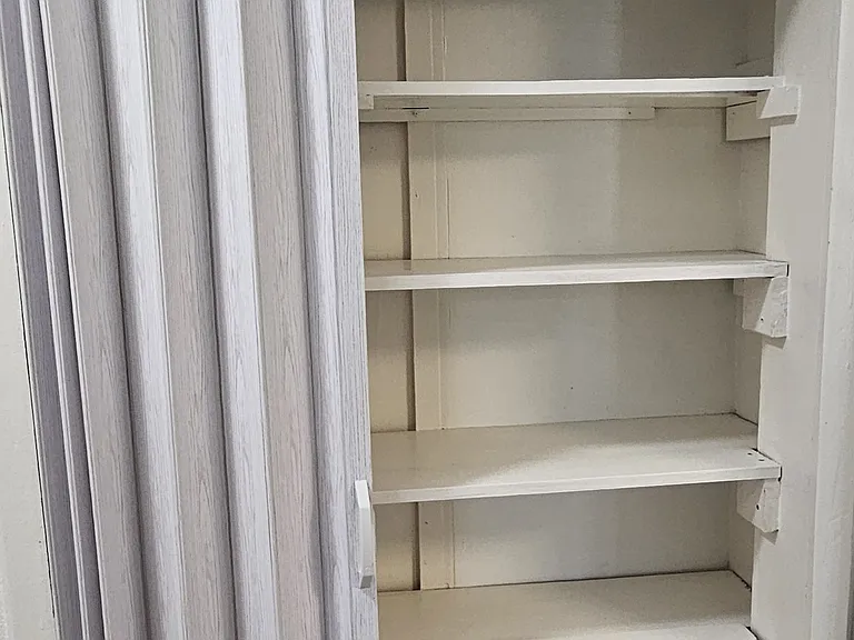 Linen and storage closet in hallway