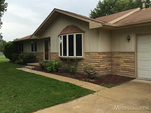 Driveway is extended on the right side for extra parking.