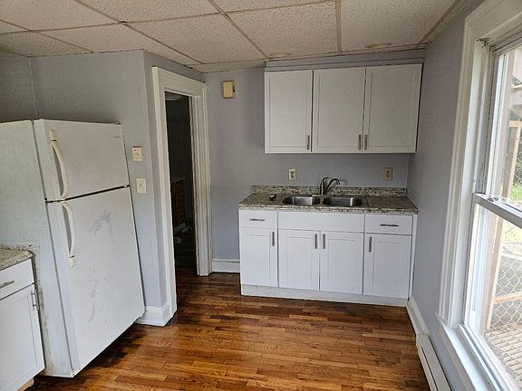 The stove and refrigerator have been replaced with new stainless steel appliances.
