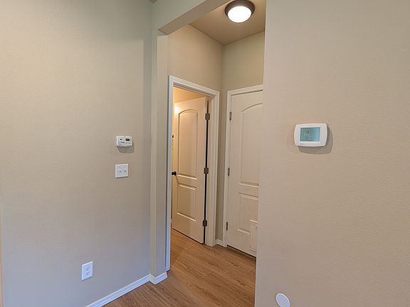 CO2 monitor, and forced air system. Door to garage, under-the-stairs storage, and guest bath.