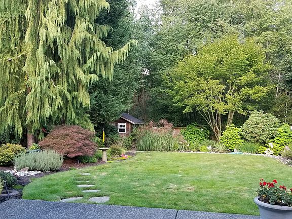 Back yard with garden/potting shed and fountain