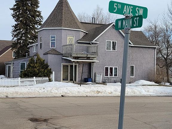 Unit #4 has the second story windows and balcony in this picture.