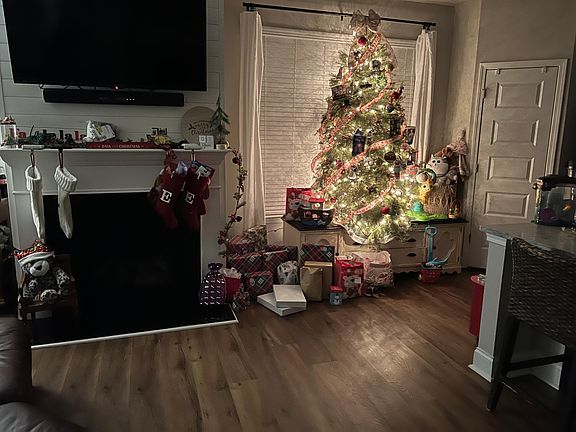 Living room w/ Shiplap fireplace and tv mount (tv will not stay, the tv mount will)