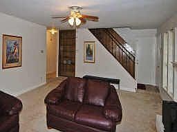 STAIRWAY COMES DOWN TO THE BACK DOOR ... BUILT IN BOOKSHELVES HERE TOO