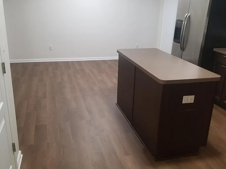 Kitchen. Dining area at far end