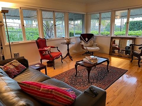 living room with wrap around windows