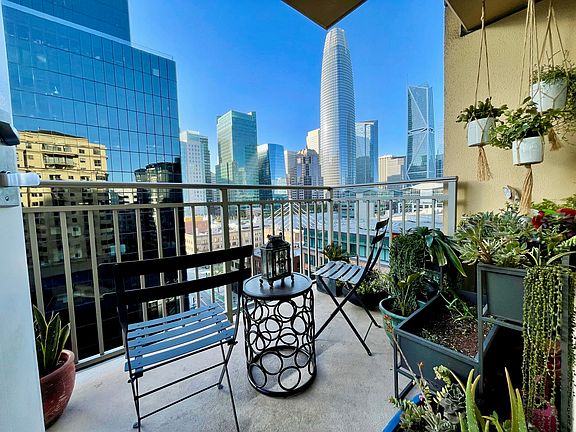 Private balcony with downtown skyline and Salesforce Tower views.