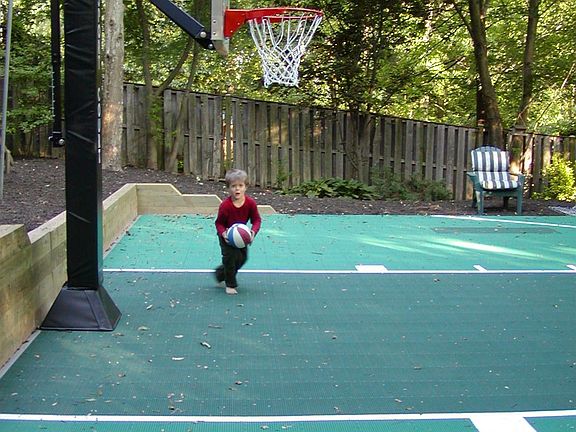 Sport Court with adjustable fiberglass backboard/goal