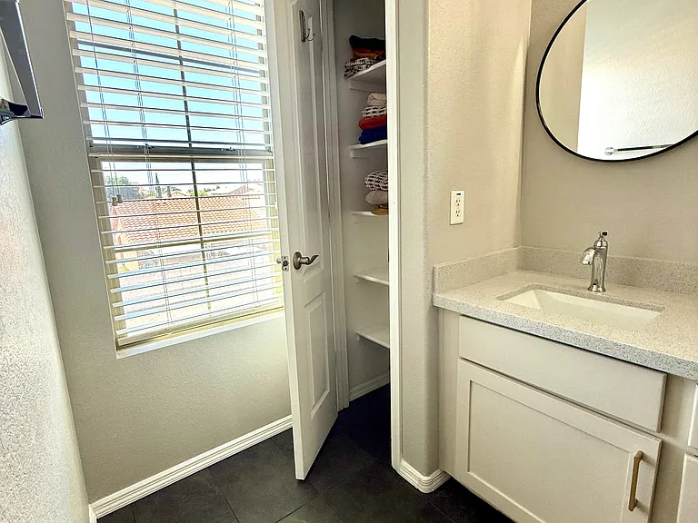 LARGE LINEN CLOSET IN PRIMARY BATHROOM