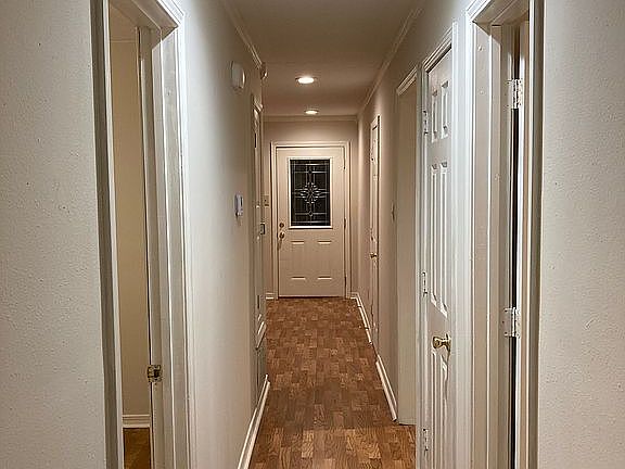 Hall to 3 bedrooms and baths