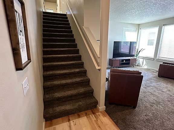 Walking in from the front door, living room on your right and all the rooms are up stairs