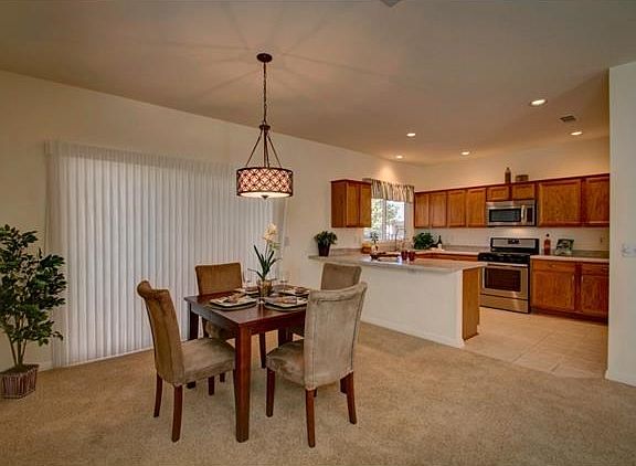Dining area, with kitchen area in background
