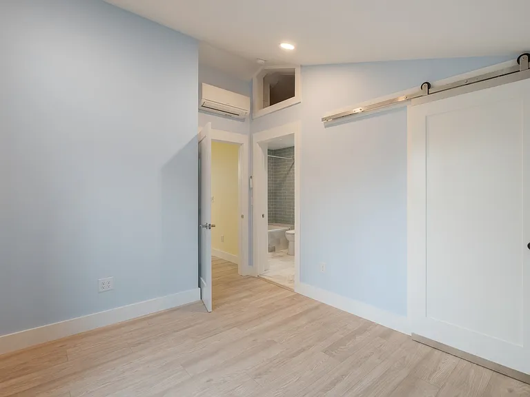 Upstairs bedroom with full bath and walk-in closet.