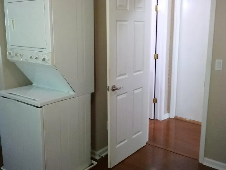 stack washer and dryer in bedroom