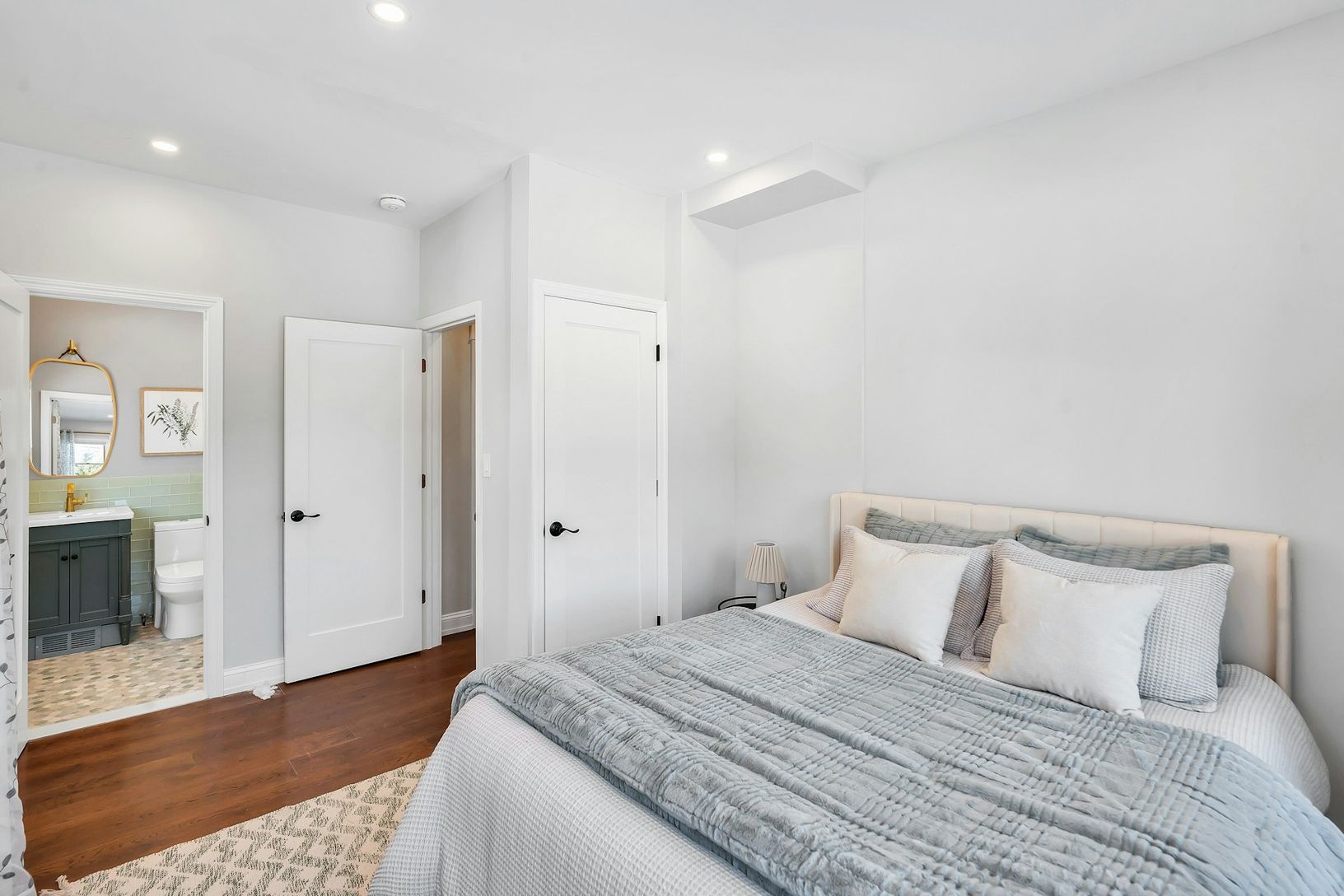  First floor bedroom with closet and ensuite full bathroom with soaking tub.