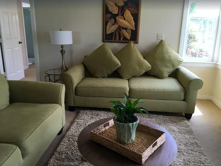 Living room, 2 couches, and bay window-overlooks pastures and Mauna Kea Mountain