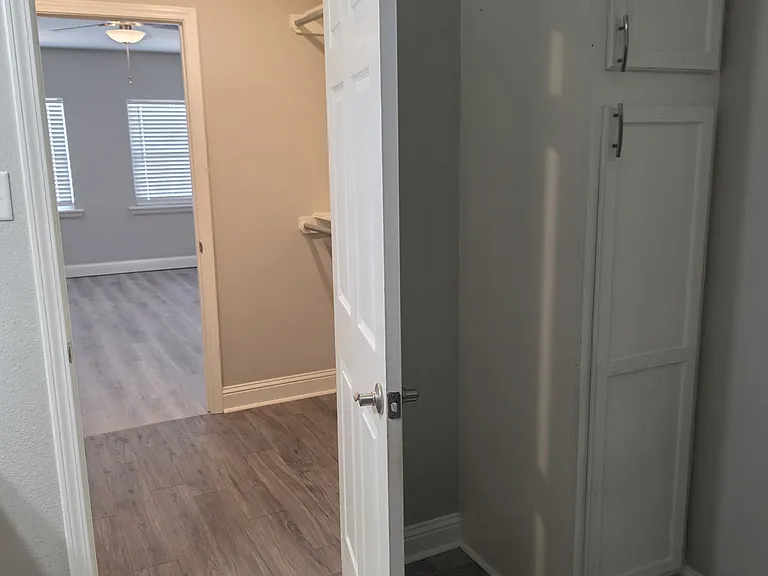 Inside master bathroom looking towards master closet and bedroom