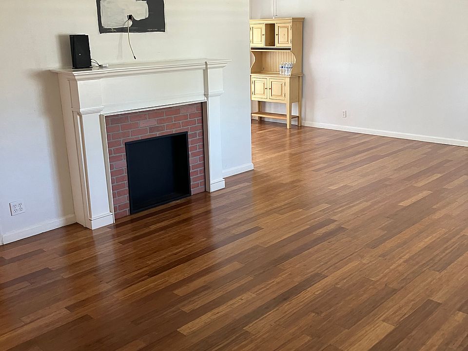 Large living room with faux fireplace