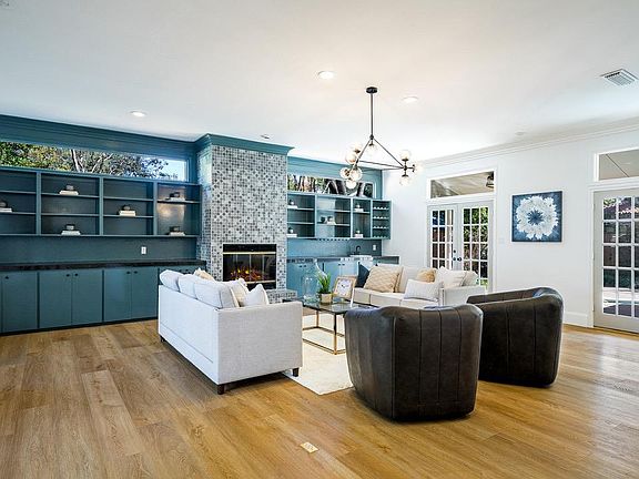 Living Room with Double French Doors that Lead to Back Patio