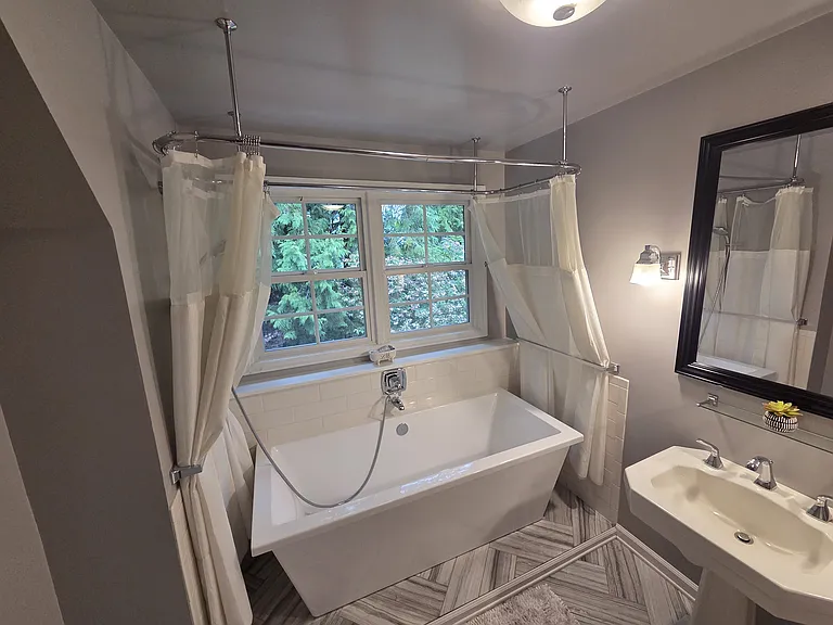 The spacious upstairs bathroom features a relaxing soaking tub for your private, spa-like retreat
