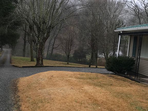 View over looking driveway and creek that runs along side of