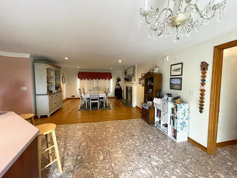 Kitchen looking towards family room with fireplace