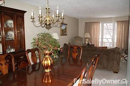 Large neutral living and dining room! : Floor to ceiling windows in this area provide an abundance o