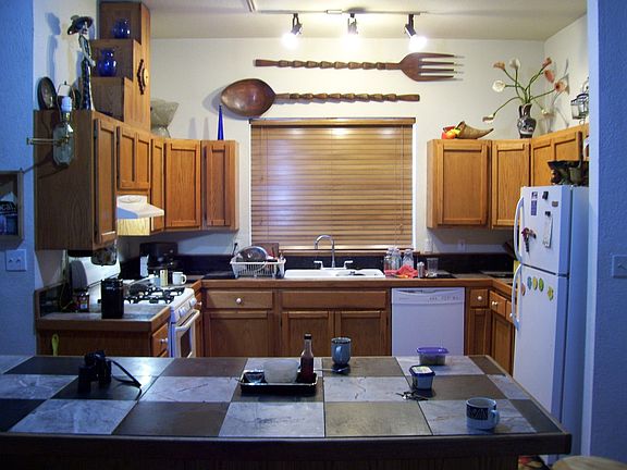 Kichen off den w. marble tiles, real wood cabinets