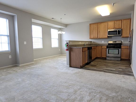 Living Room view to Dining Area & Kitchen