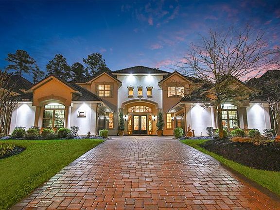 Home has soffit lighting making it a stunning presentation at night on this desirable interior lot.