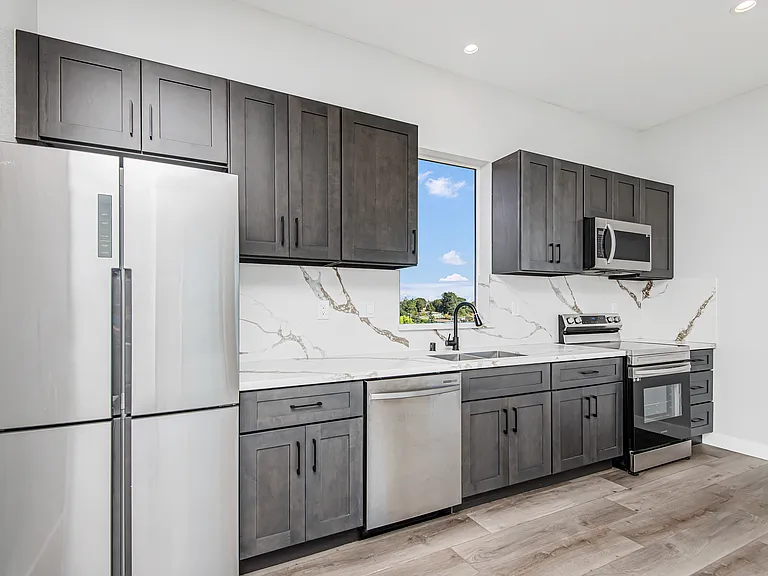 Stainless steel appliances - french refrigerator, quartz countertop