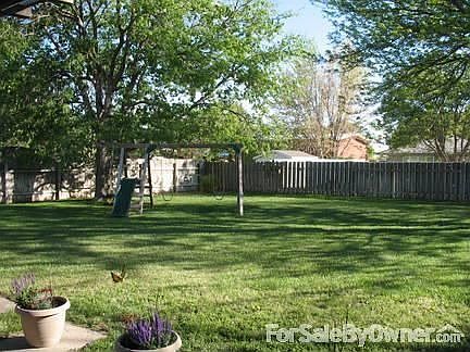 Huge back yard
						:
						Yard has sprinkler system and storage shed. Swingset is negotiable.