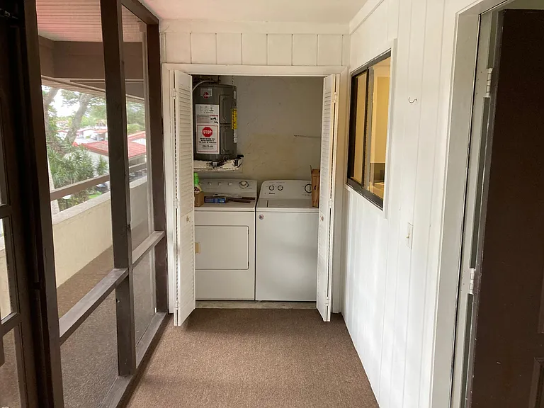 Washer and dryer combo on front porch.
