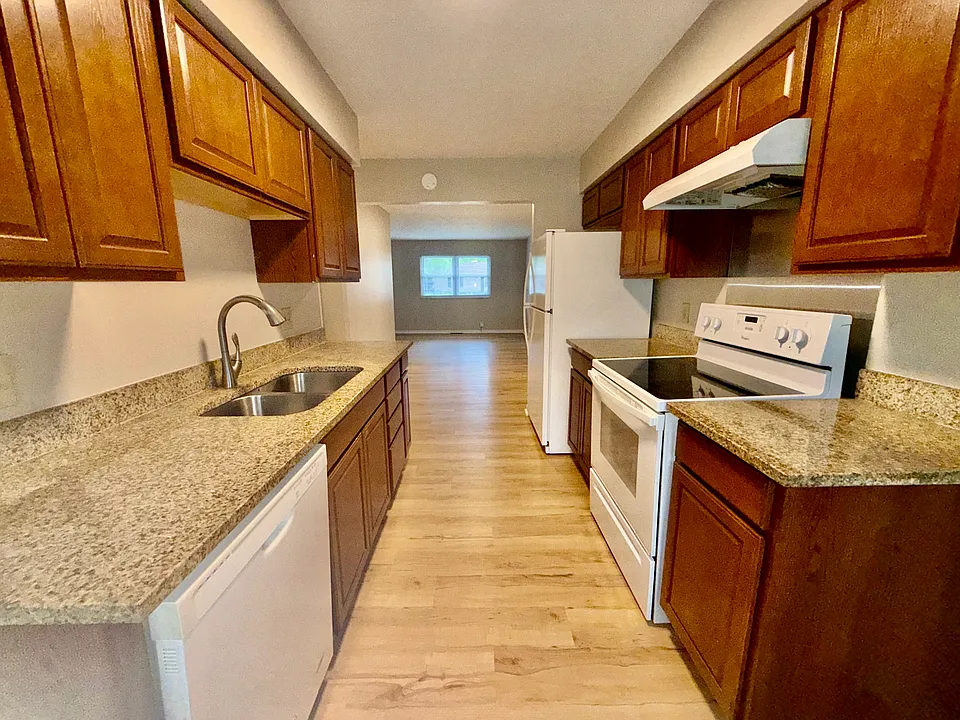 Kitchen with granite counter tops.