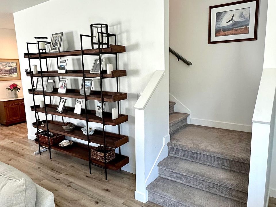 Second floor stairway to third floor, adjacent to family room.