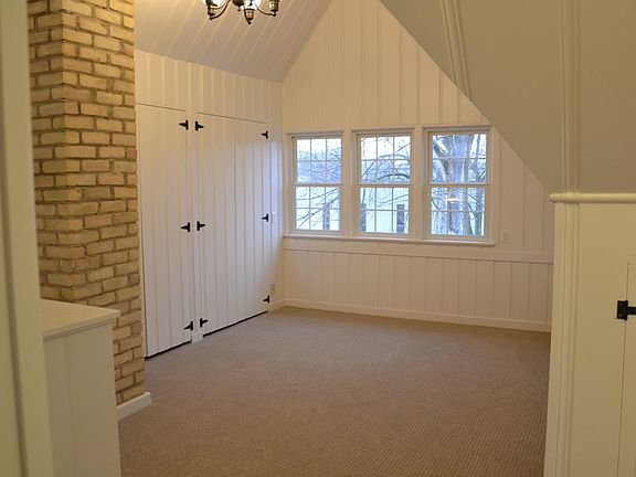 Upstairs loft or bedroom with vaulted ceilings