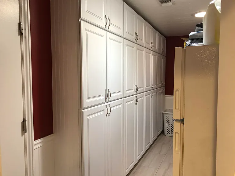 Laundry Room with built in pantry cabinets