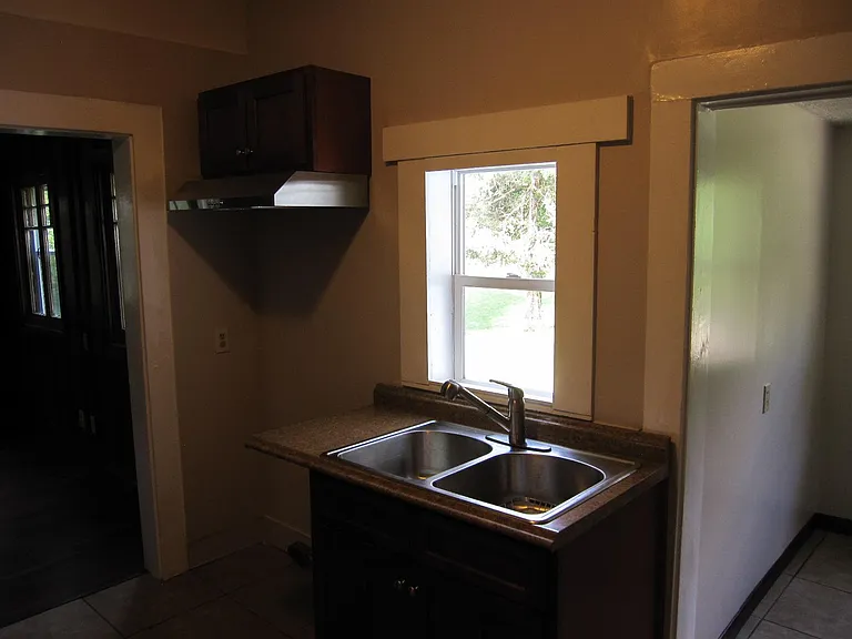 Another angle view of kitchen. Newer black range not in picture.