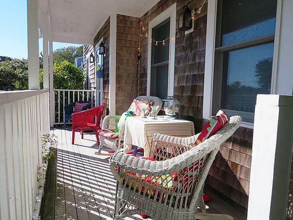 Covered front porch seating area for relaxing. Front entranc