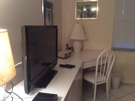 Bedroom w flat screen