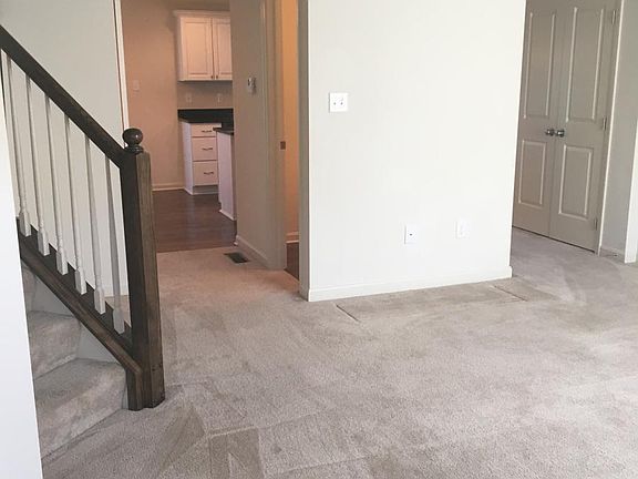 Large living area with site lines to kitchen - large double-door pantry in hall